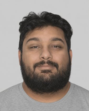 Computer-generated image showing Joseph Tennis with a full beard and dark hair, front facing, plain grey background.